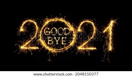 Goodbye outgoing 2021 year. Beautiful creative holiday web banner or flyer with Golden sparkling text Goodbye in number 2021 on black background. Object for design