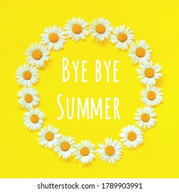 Goodbye Summer Text And Flower Composition. Frame Floral Round Wreath Of Flowers Chamomile On Yellow Background. Greeting Card.