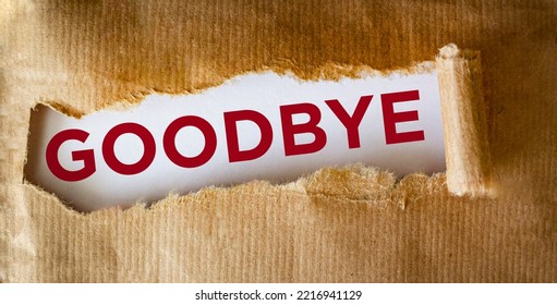 Goodbye Text Appearing Behind Torn Brown Paper