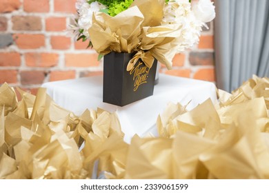 Goodie bag on a table with printed Thank you message - Shutterstock ID 2339061599