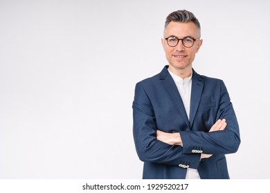 Good-looking middle-aged businessman with arms crossed isolated in white background - Powered by Shutterstock
