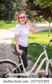 Good-looking woman with a bike looking enjoyed and excited
