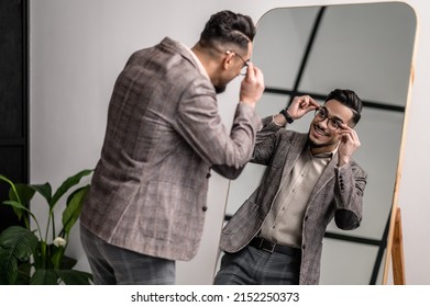 A Good-looking Young Elegant Man At The Mirror