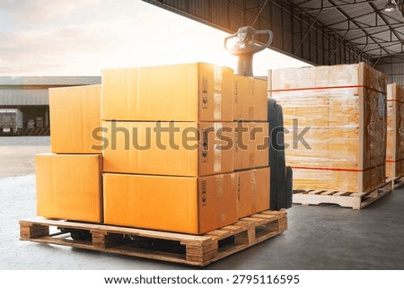 Goods awaiting loading into containers trucks. bulk of package boxes shipment. cartons, cardBoard boxes stacked on pallets. distribution warehouse shipping, cargo shipment. freight transportation	