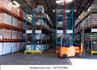 Goods and materials arranged on a rack in warehouse. This is a freight transportation and distribution warehouse. Industrial and industrial workers concept