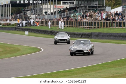 Goodwood, Sussex / UK - 13 Sept 2019: A Grey 1961 Janguar E-type Vintage Sports Car (number 26) Races Around The Circuit During The Goodwood Revival Event. Driven By Jack And John Young.