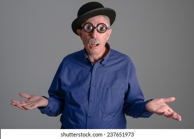 Goofy Man With Thick Glasses Looking At The Camera