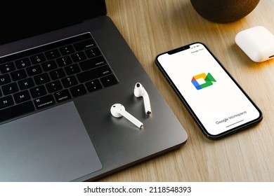 Google Meet App On The Smartphone Screen On Wooden Background. Office Environment. Rio De Janeiro, RJ, Brazil. February 2022.