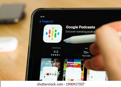 Google Podcast Logo Shown By Apple Pencil On The IPad Pro Tablet Screen. Man Using Application On The Tablet. December 2020, San Francisco, USA.