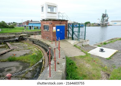 Goole, East Yorkshire, UK, 
May 21, 2022 
Looking over the inland waterway of Goole docks with rusting lock gates in the foreground.