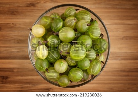 Similar – Image, Stock Photo Top view of organic gooseberries in a vintage bowl