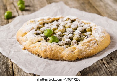 Gooseberry Rustic Tart On Rough Wooden Background. Galette Or Crostata With Fresh Berries. Selective Focus 