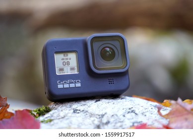 GoPro 8 Action Camera Sitting On A Rock In Autumn