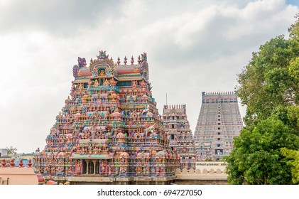 The Gopurams, monumental entrance towers, decorated with ornate sculptures of Hindu gods and goddess of the Srirama Puram Temple in Srirangam, Tamil Nadu, India - Shutterstock ID 694727050