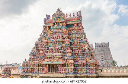 The Gopurams, monumental entrance towers, decorated with ornate sculptures of Hindu gods and goddess of the Srirama Puram Temple in Srirangam, Tamil Nadu, India - Shutterstock ID 694727062