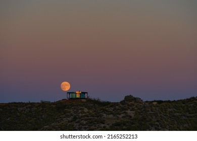 GORAFE, SPAIN, OCTOBER 19, 2021, The Full Moon Rises Over The Glass House In The Desert.