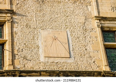Gordes, France - August 2021 : Sundial on the wall of the old castle of Gordes, the Vasarely Museum, on the Place Genty Pantaly square