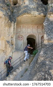 GOREME, TURKEY - JUNE 02, 2011 : Visitors To The Open Air Museum Climb The Stairs To Enter The Ancient Saint Barbara Church Which Dates From The Iconoclastic Period. Goreme Is Located In Cappadocia.