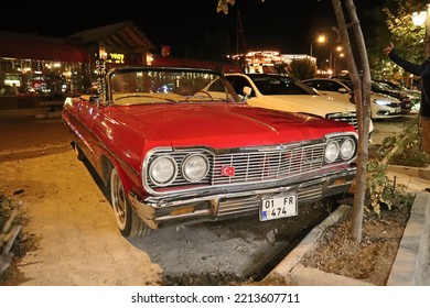 Goreme Turkey, September 18 2022. Red Vintage Retro Car Parked On The Street On The Night In Turkey