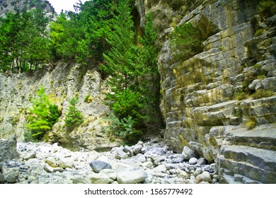 The Samariá Gorge Is In Samariá National Park, In Western Crete, Greece. A Trail Runs Along The Gorge From The Xylóskalo Trailhead, In The White Mountains, To The Seaside Village Of Agia Rouméli.