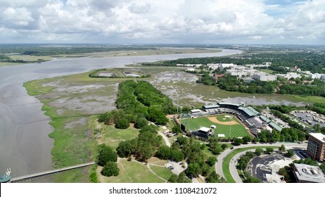 Gorgeous Aerial View Of Baseball Stadium Near Body Of Water In Charleston.