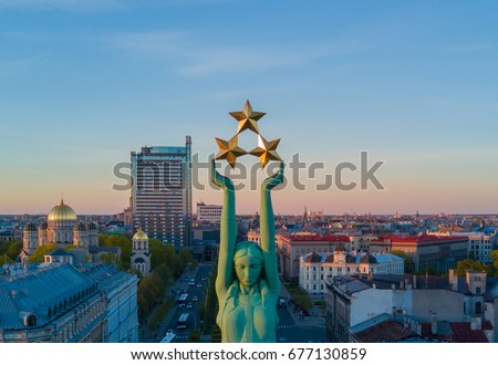 Gorgeous aerial view of the statue of liberty Milda in Riga during sunset