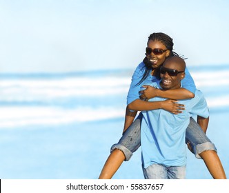 Gorgeous African American couple have fun at the seaside