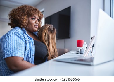 Gorgeous Afro-American Lady With Bouncy Curly Hair Smiling While Holding A Straight-hair Wig