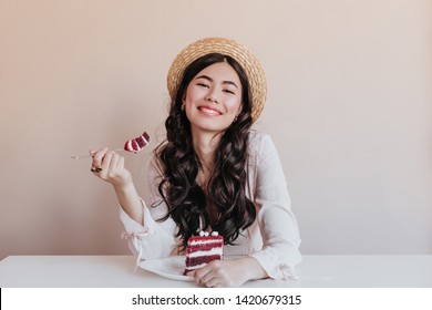 Gorgeous Asian Woman Eating Cake. Smiling Birthday Girl Enjoying Dessert.