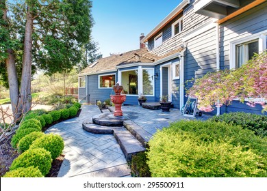 Gorgeous Back Yard With Patio Including Elegant Fountain And Lots Of Greenery.