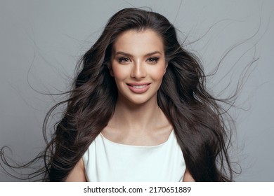Gorgeous beautiful fashion model woman with makeup and long blowing hair with wind on white background portrait - Shutterstock ID 2170651889