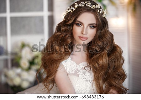 Similar – Image, Stock Photo bride in a long white dress with a wedding bouquet along with a groom in a stylish suit after a wedding ceremony in front wall with green ivy