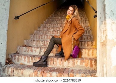 Gorgeous Blonde Girl With Cite Smile Sitting On Stairs , Fall Fashion Collection