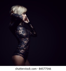 gorgeous blonde in lace dress, isolated on black, studio shot, space for copy