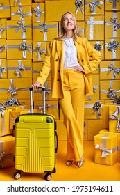 Gorgeous Caucasian Woman Is Preparing To Go On Journey, Trip, Posing With Yellow Suitcase, New Life And New Opportunities Cocnept