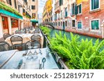 Gorgeous cityscape of Venice with narrow canals, boats and gondolas and bridges with traditional buildings. Location: Venice, Veneto region, Italy, Europe