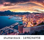 Gorgeous evening cityscape of Calvi port. Fabulous summer sunset on Corsica island, France, Europe. Incredible seascape of Mediterranean sea. Traveling concept background.