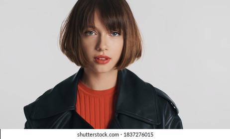 Gorgeous Fashion Model With Bob Hair And Red Lips Looking Disheveled On Camera Isolated On White Background