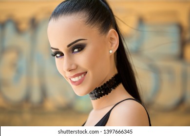 Gorgeous Fashionable Young Brunette Woman In Heavy Dark Makeup. 