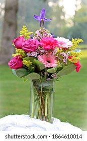 A Gorgeous Flower Bouquet With Roses, Carnations, Gerbera Daises, And Irises.