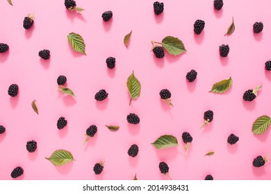 Gorgeous Fruit Pattern Of Berries On Pink Background. Fresh ,organic Blackberries And Leaves . Top View.Flat Lay.