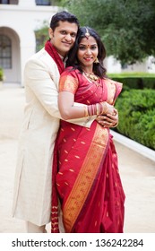 Gorgeous Indian Bride And Groom Looking At Camera