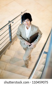 Gorgeous Middle Aged Businesswoman Walking Up Stairs