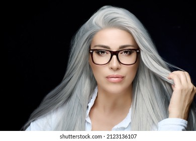 Gorgeous Midle-age Woman With Spectacles Looking At Camera. Eyewear And Clear Vision Concept. Isolated On Black With Copy Space