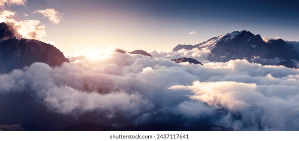 Gorgeous morning fog shrouded the rocky peaks. Location place glacier Marmolada, Italian Alps, Dolomiti, South Tyrol, Europe. Photo wallpaper. Drone photography. Discover the beauty of earth. - Powered by Shutterstock