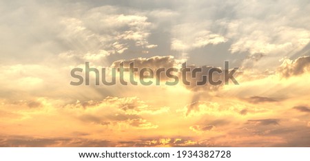 Gorgeous panorama scenic of the sunrise or sunset with silver lining and cloud on the orange sky