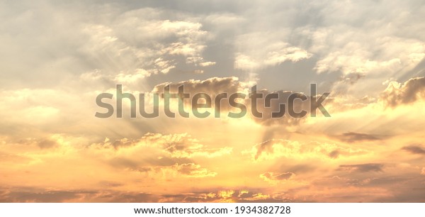 Gorgeous panorama scenic of the\
sunrise or sunset with silver lining and cloud on the orange\
sky