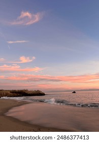 Gorgeous pink sunset on the beach in beautiful Santa Cruz, California.
