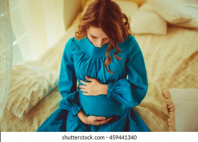 Gorgeous Pregnant Woman Doing A Photo Shoot At Home