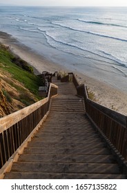 Gorgeous scenic background of wooden steps leading down to the ocean during a calm sunset in Cardiff by the Sea, California, north of San Diego on the Pacific Coast